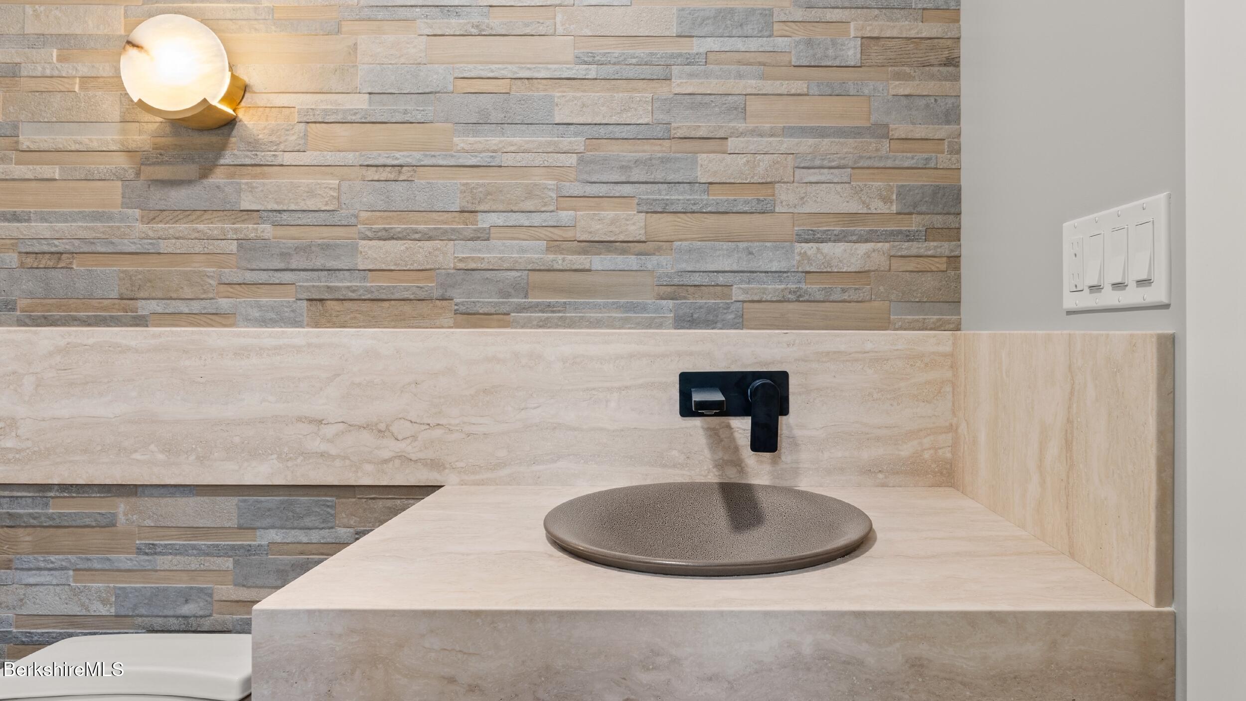 55 Main Street Stockbridge, MA 01262 - Photo 26 of 54 a bathroom with a sink and a mirror