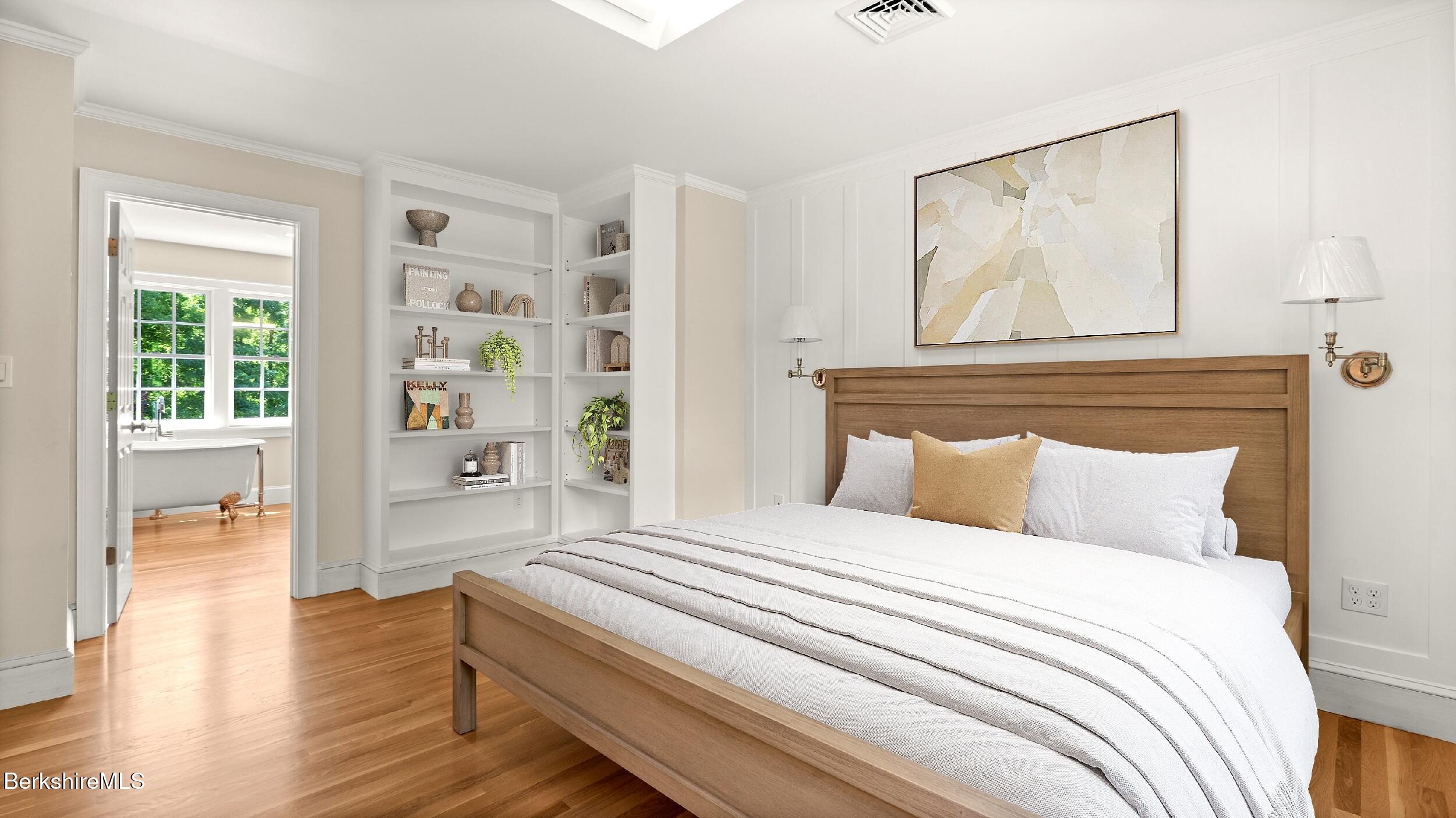 55 Main Street Stockbridge, MA 01262 - Photo 29 of 54 a bedroom with a bed and a painting on the wall