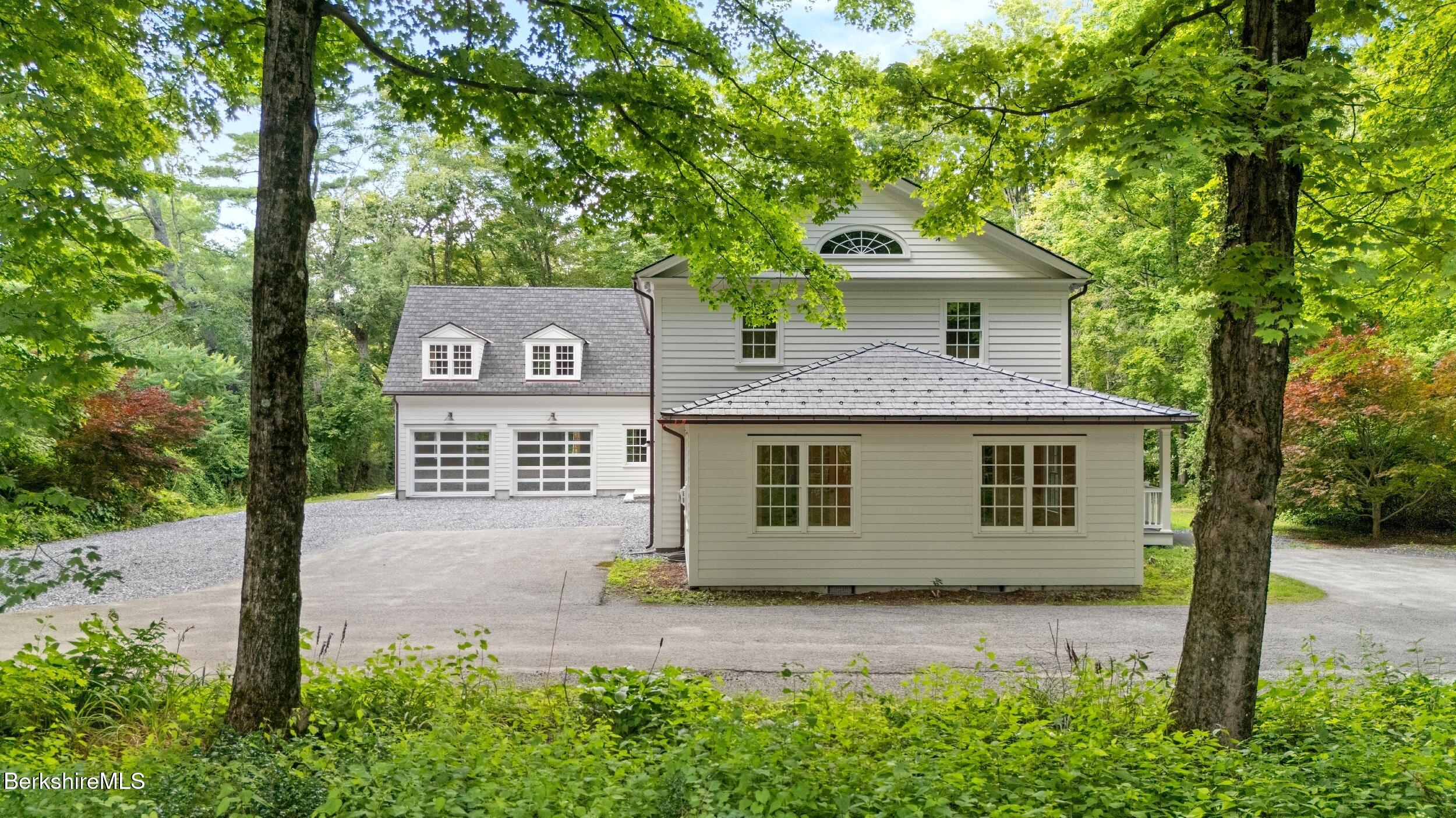 55 Main Street Stockbridge, MA 01262 - Photo 3 of 54 a front view of a house with garden
