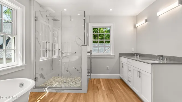 a bathroom with a sink and a window