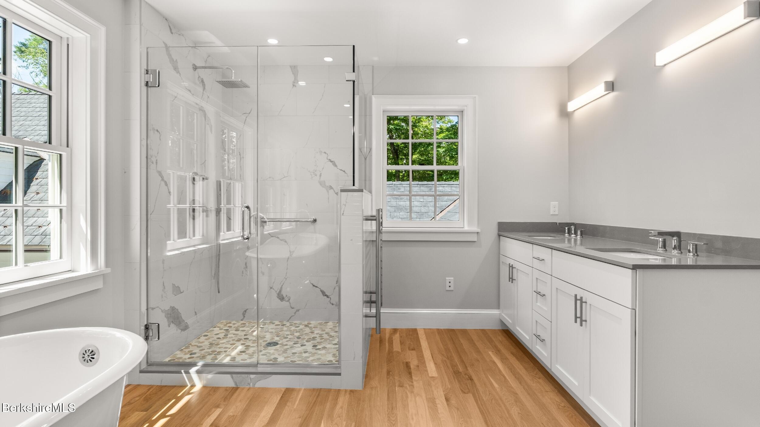 55 Main Street Stockbridge, MA 01262 - Photo 31 of 54 a bathroom with a granite countertop sink a toilet and shower