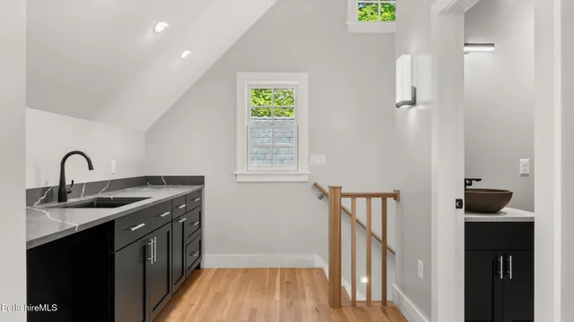 a large white bed in a white room
