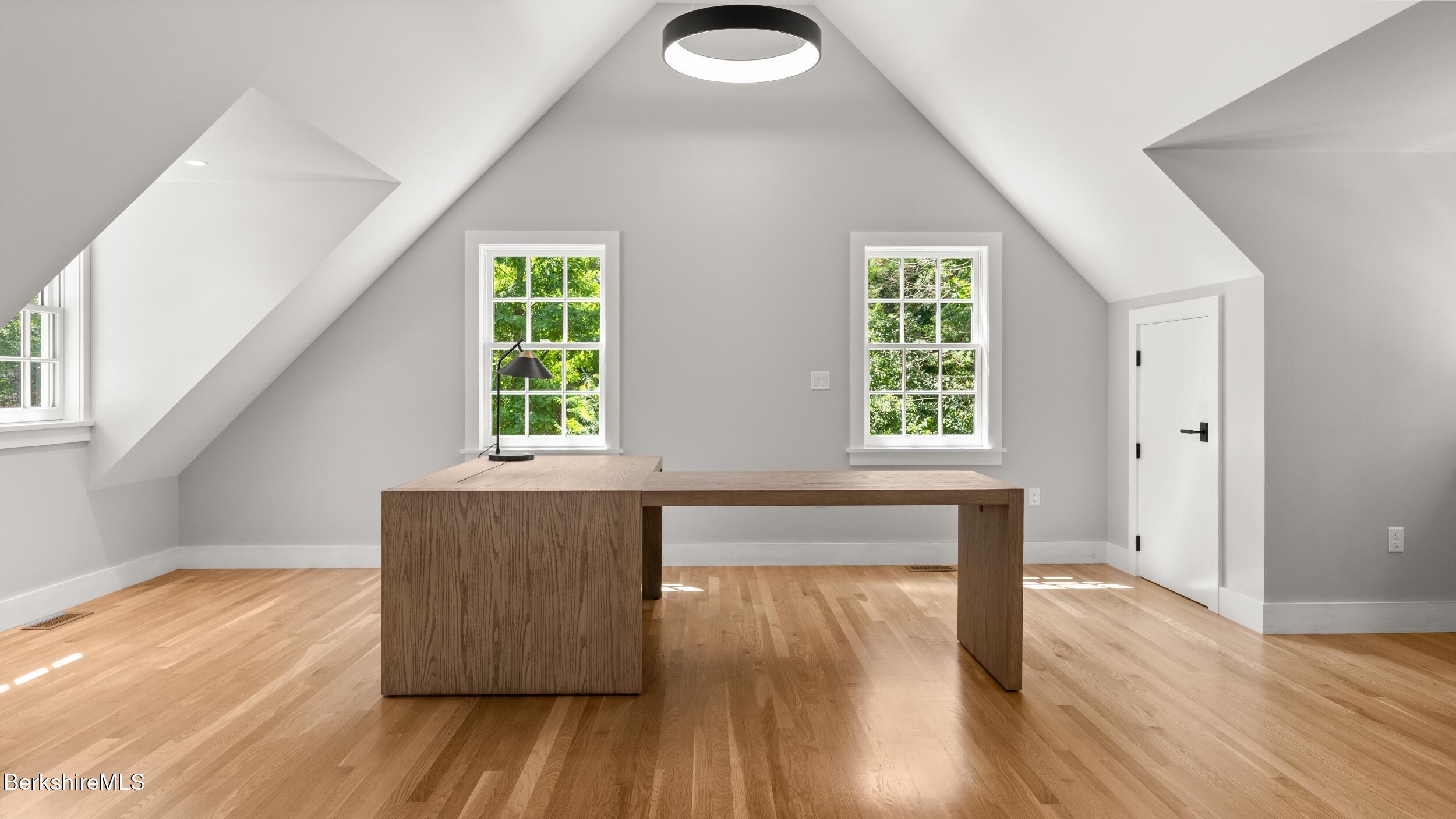 55 Main Street Stockbridge, MA 01262 - Photo 39 of 54 an empty room with wooden floor and windows