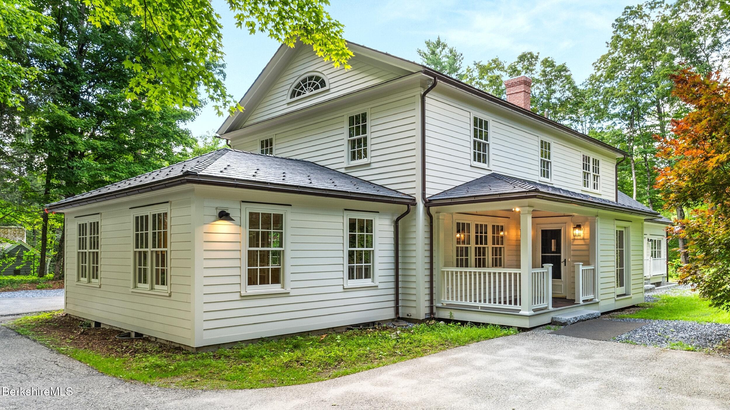55 Main Street Stockbridge, MA 01262 - Photo 44 of 54 a front view of a house with a garden