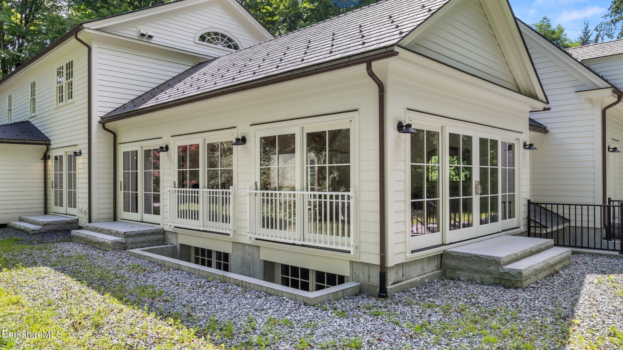 55 Main Street Stockbridge, MA 01262 - Photo 48 of 54 a view of a house with a window and wooden fence