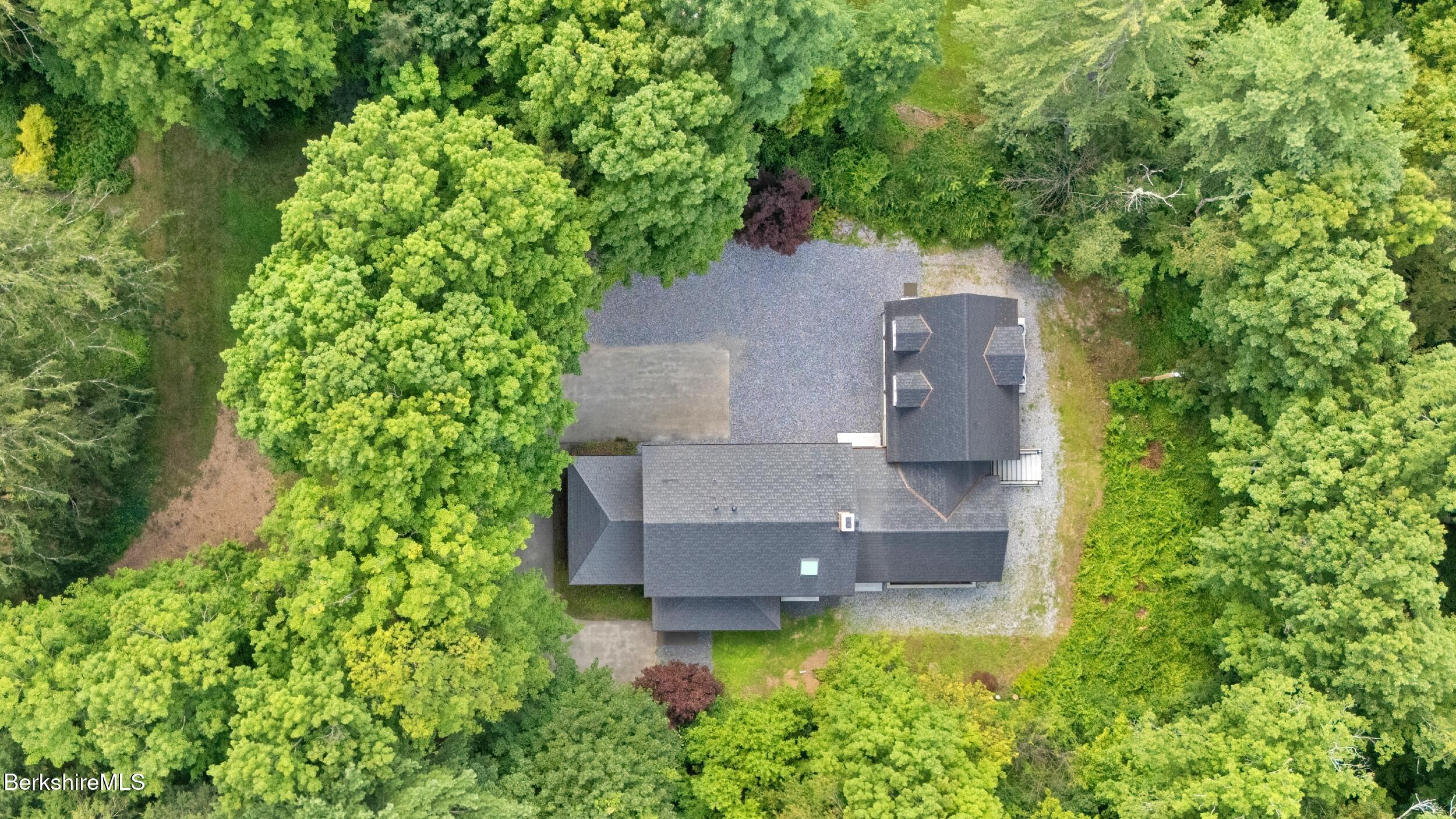 55 Main Street Stockbridge, MA 01262 - Photo 49 of 54 an aerial view of a house with a yard basket ball court and outdoor seating