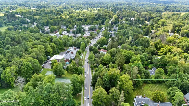 a picture of a room with a white wall and a large window