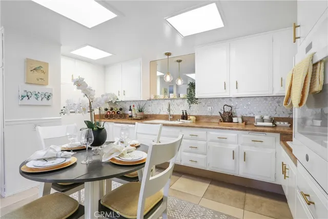 a kitchen with a dining table and chairs