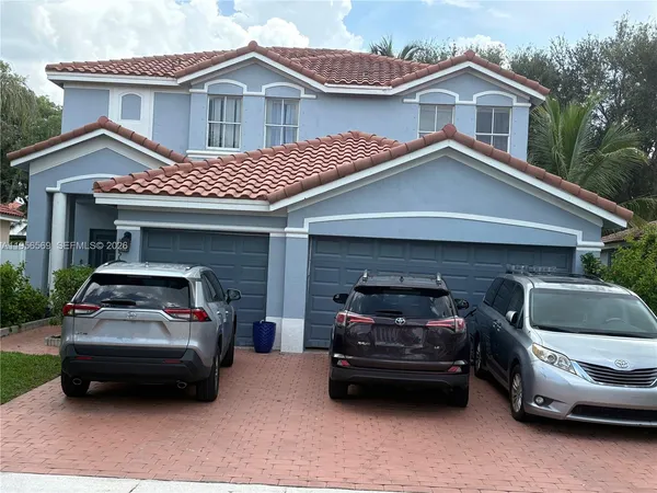 a car parked in front of a house