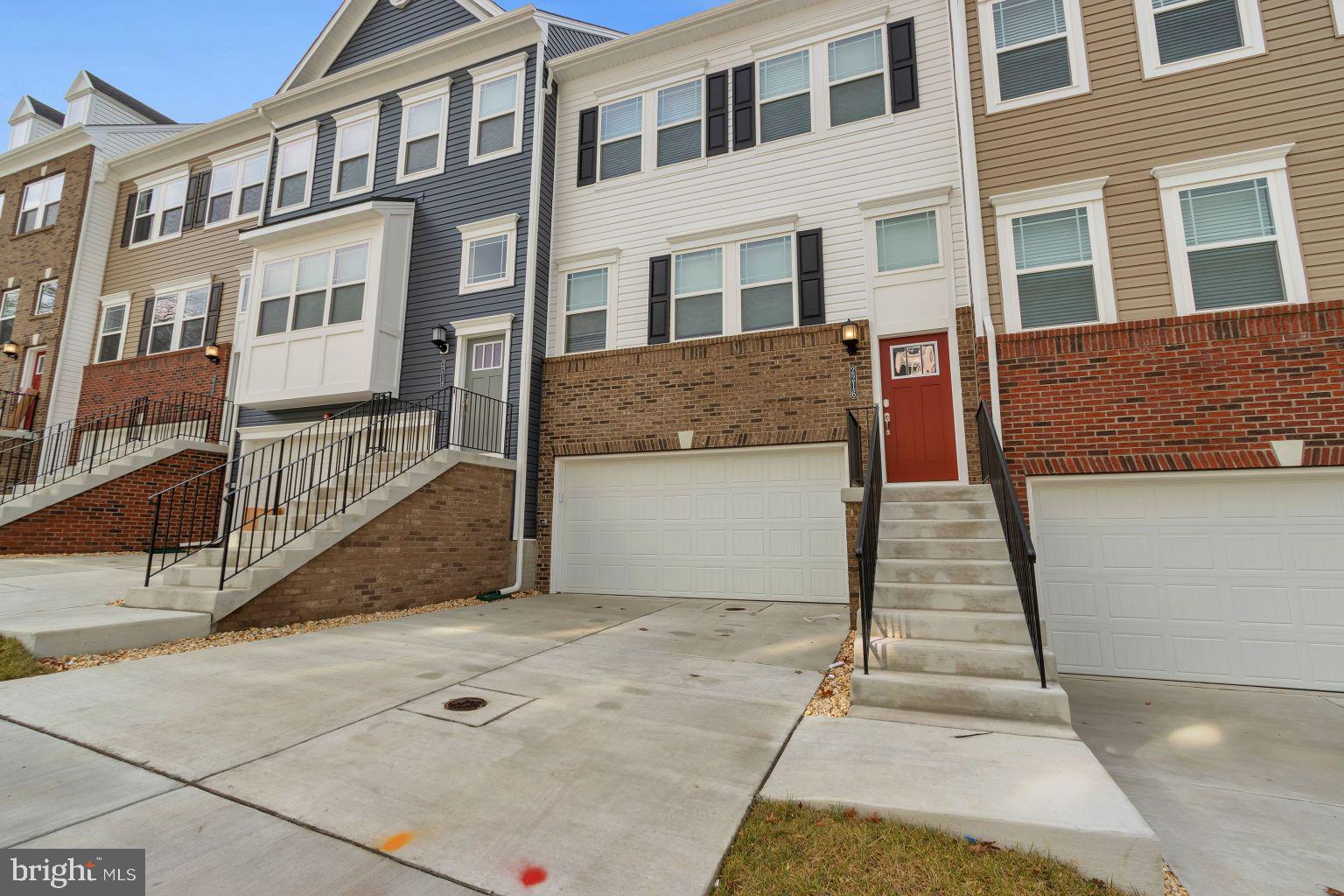 a view of a brick house with many windows