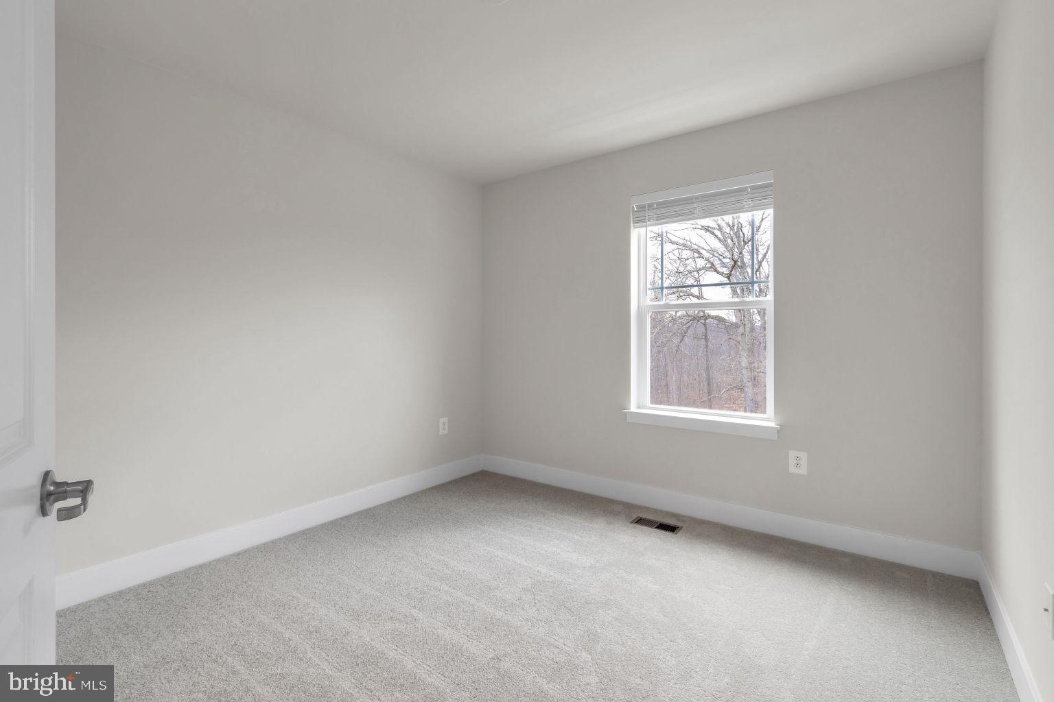 2216 Partin Road Windsor Mill, MD 21244 - Photo 21 of 25 an empty room with a window