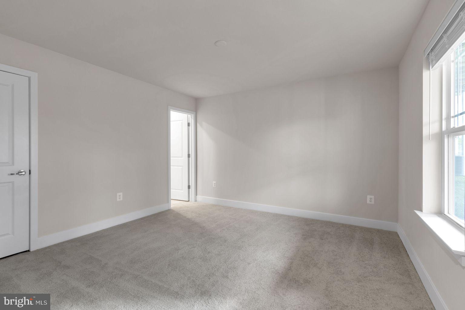 2216 Partin Road Windsor Mill, MD 21244 - Photo 22 of 25 an empty room with windows and closet