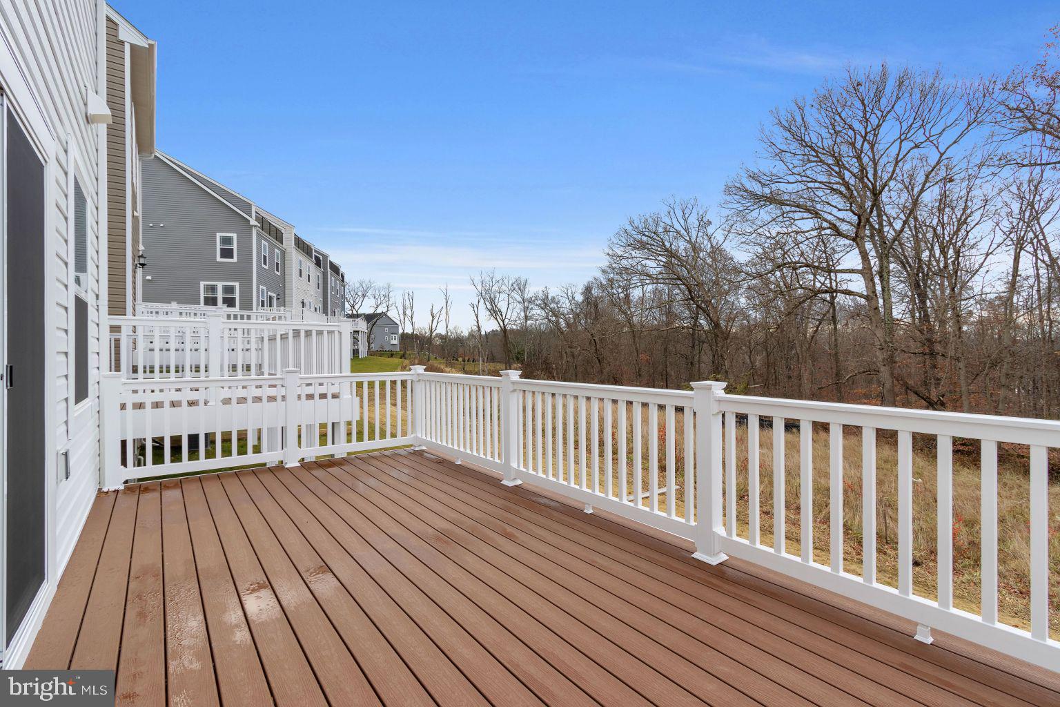 2216 Partin Road Windsor Mill, MD 21244 - Photo 23 of 25 a view of balcony with wooden floor and fence