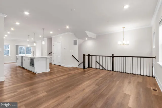 a view of a kitchen with a sink and a window