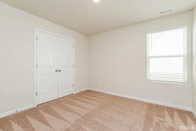 a view of a white house with a door