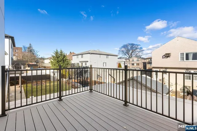 a view of a balcony with wooden floor