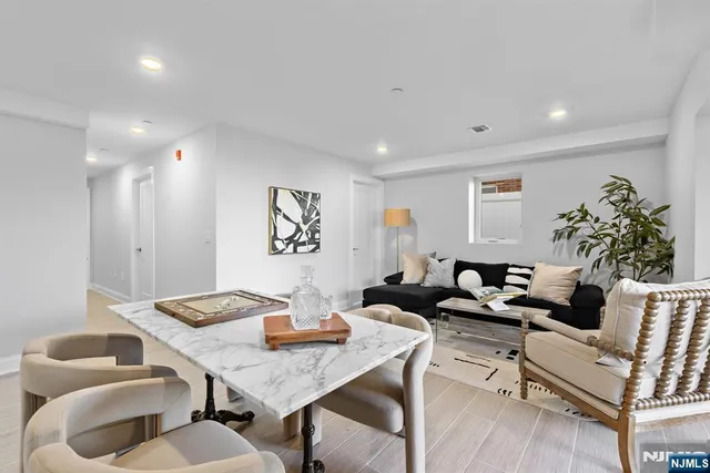 a living room with furniture and a table