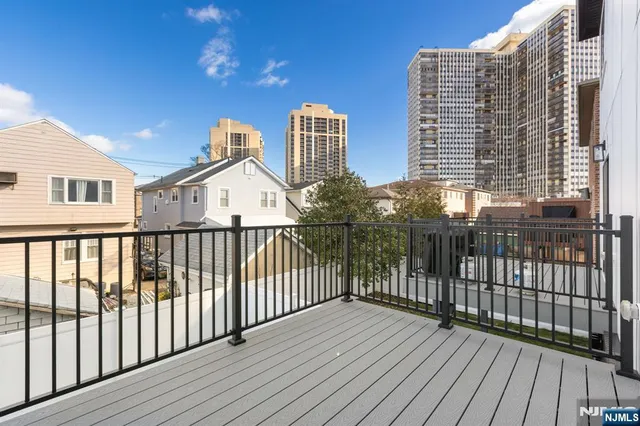 a view of balcony with wooden floor