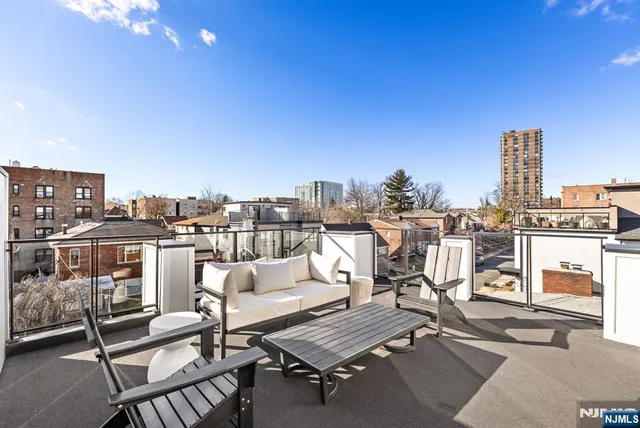 a view of a terrace with seating area