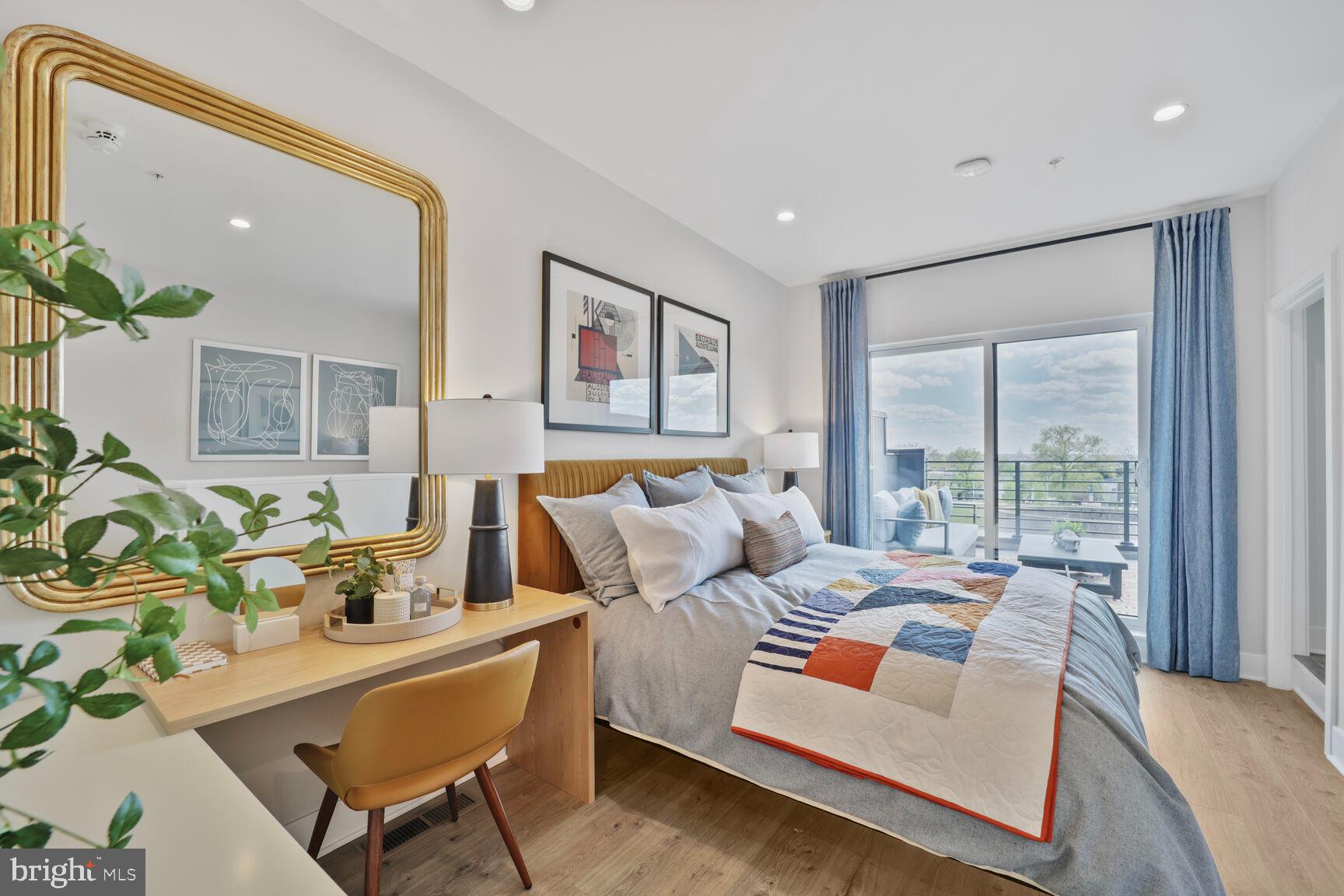 61 Lower Service Road Northwest, Unit ATWOOD 891 Washington, DC 20422 - Photo 20 of 21 a living room with furniture and a large window