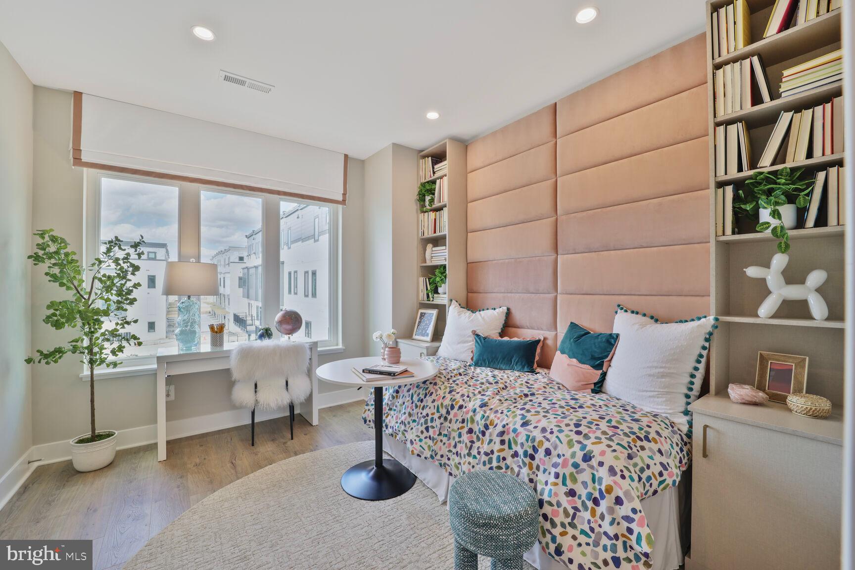61 Lower Service Road Northwest, Unit ATWOOD 891 Washington, DC 20422 - Photo 9 of 21 a living room with furniture and a potted plant