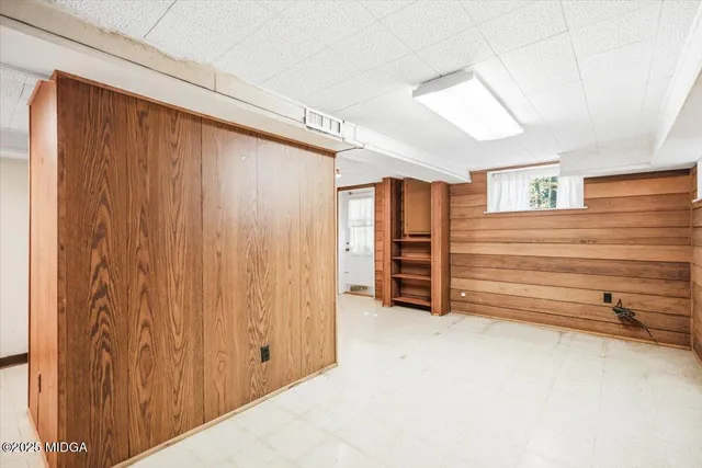 a view of room with stairs and a ceiling fan