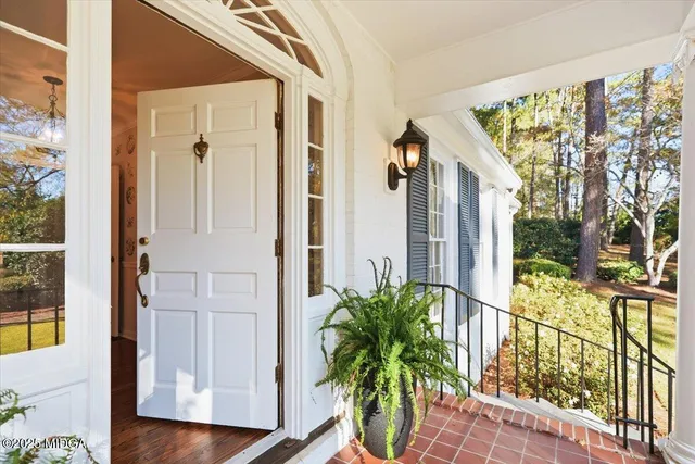 a view of balcony with furniture