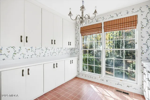 a view of a kitchen with granite countertop window and wooden floor