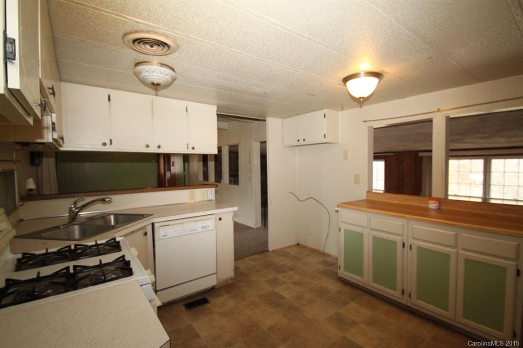5 Mountain Mission Road Clyde, NC 28721 - Photo 17 of 23 a kitchen with a stove and a refrigerator