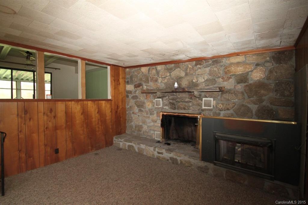 5 Mountain Mission Road Clyde, NC 28721 - Photo 8 of 23 a living room with a fireplace
