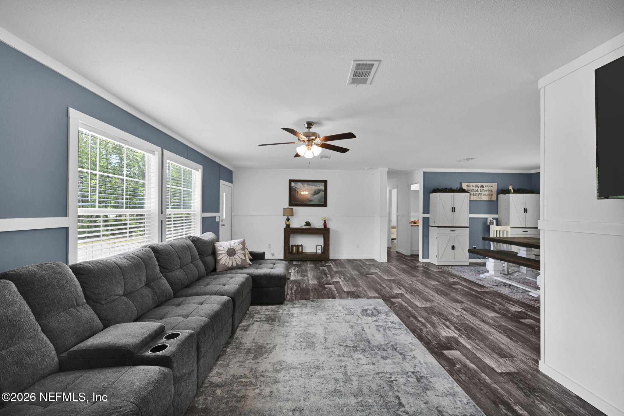 540783 Lem Turner Road Callahan, FL 32011 - Photo 11 of 36 a living room with furniture large window and flat screen tv
