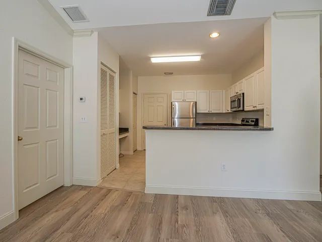 a view of kitchen with wooden floor
