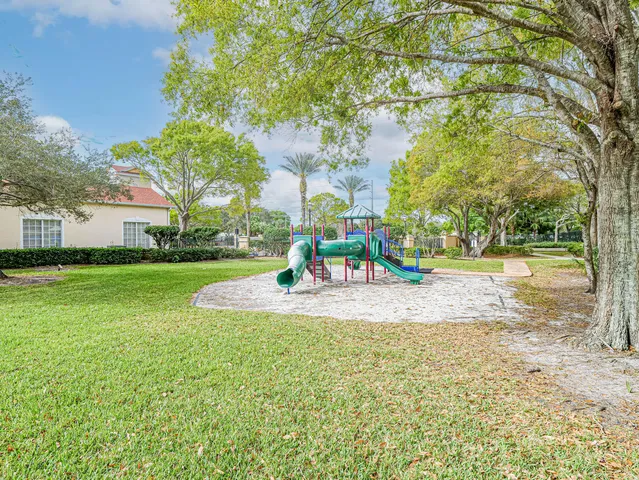 a view of a playground with basketball court
