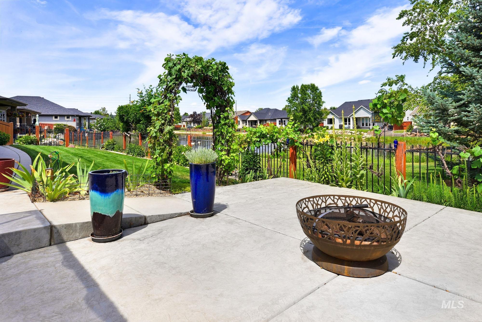 220 South Wildgrass Way Star, ID 83669 - Photo 40 of 50 Expansive concrete patio featuring a decorative metal fire pit