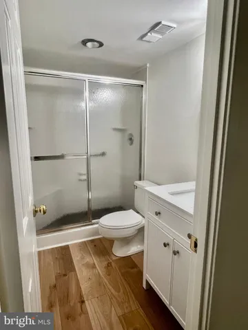 a bathroom with a shower and a toilet
