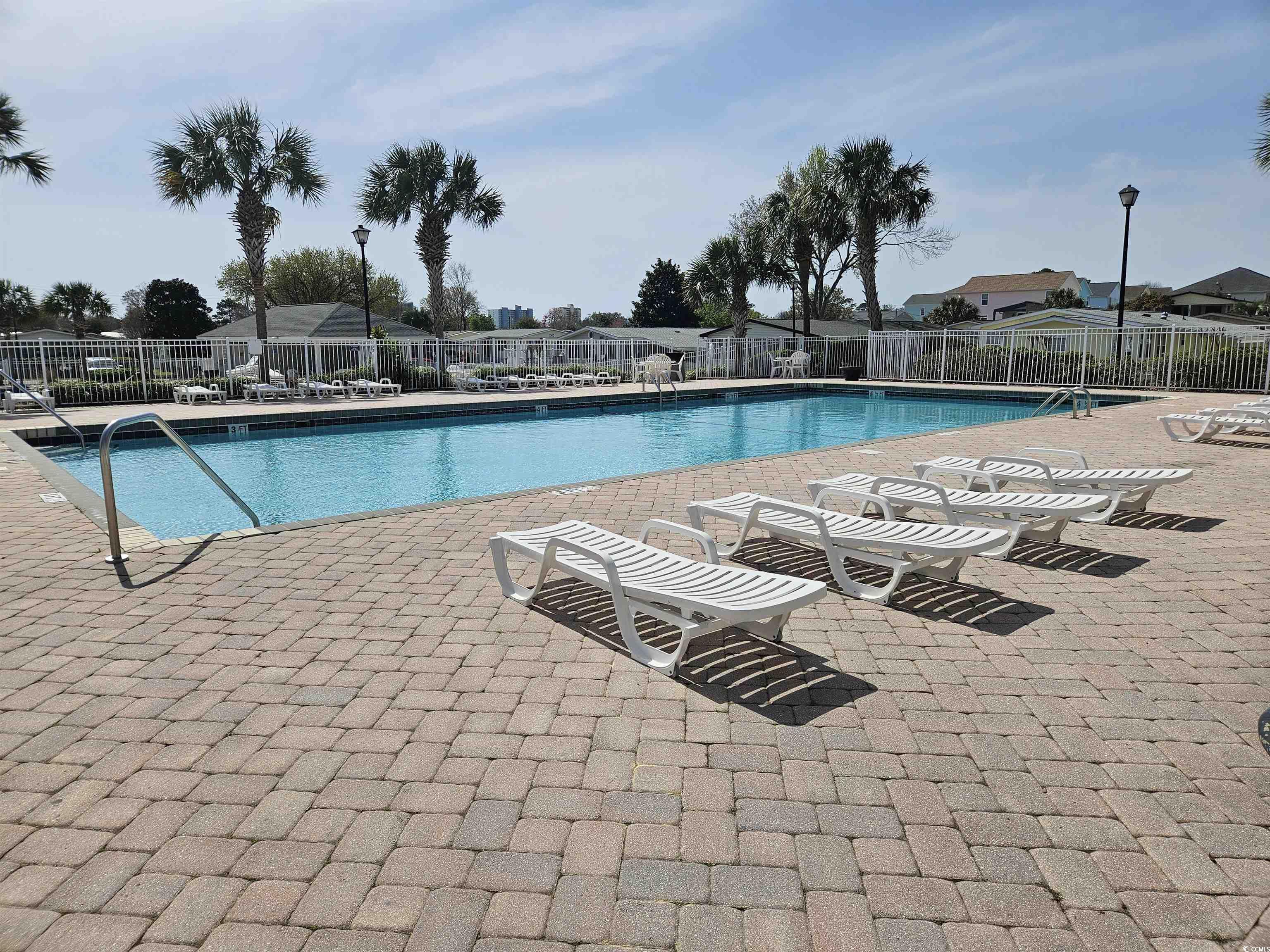 355 Meadowlark Surfside Beach, SC 29575 - Photo 28 of 39 Community pool featuring a patio area