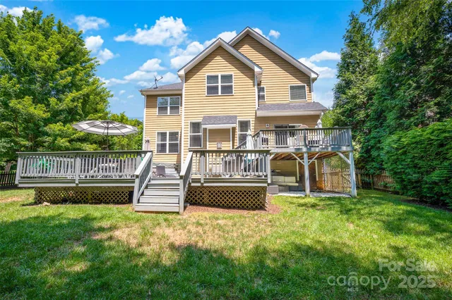 a front view of a house with a yard table and chairs