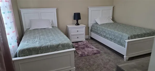 a kitchen with sink stove and cabinets