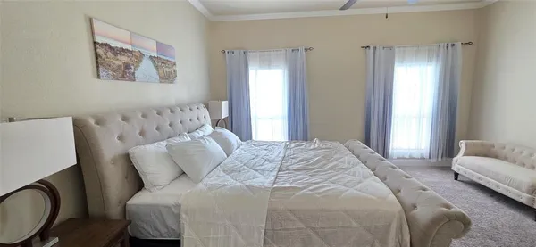 a bedroom with a bed and a sink