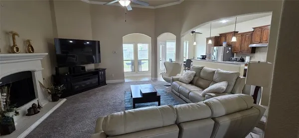 a en suite bathroom with a granite countertop sink and a mirror