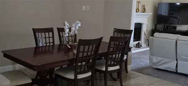 a living room with furniture fireplace and flat screen tv