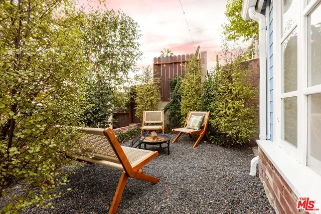 a view of a chair and table on the house