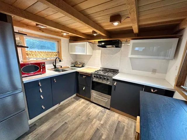 a kitchen with a stove and a refrigerator
