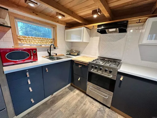 a kitchen with a stove and a sink