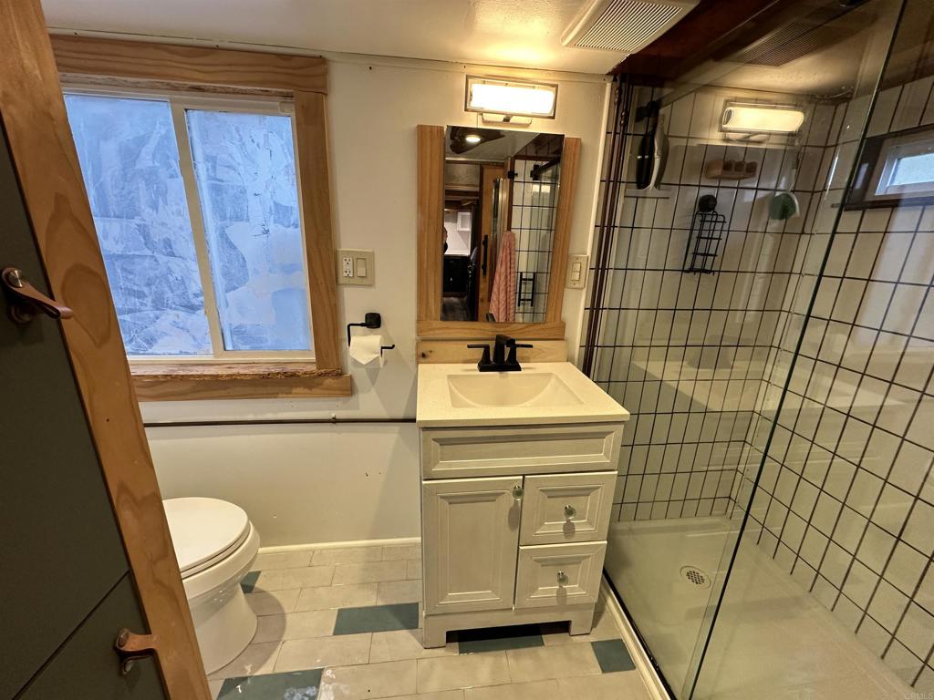 1549 North Vulcan Avenue, Unit 1 Encinitas, CA 92024 - Photo 16 of 21 a bathroom with a sink and mirror