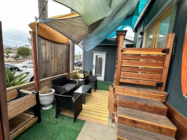 a backyard of a house with seating space