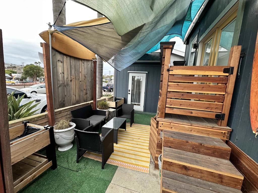 1549 North Vulcan Avenue, Unit 1 Encinitas, CA 92024 - Photo 4 of 21 a backyard of a house with seating space