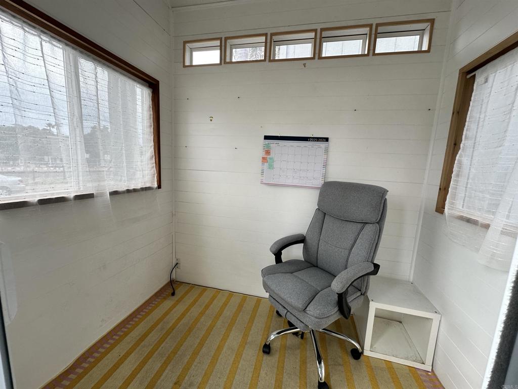 1549 North Vulcan Avenue, Unit 1 Encinitas, CA 92024 - Photo 6 of 21 a room with chairs and a table