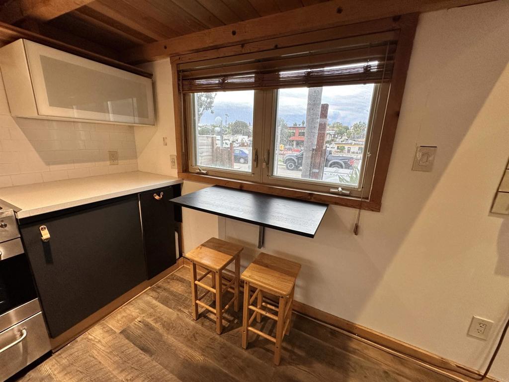 1549 North Vulcan Avenue, Unit 1 Encinitas, CA 92024 - Photo 10 of 21 a room with wooden floor and furniture