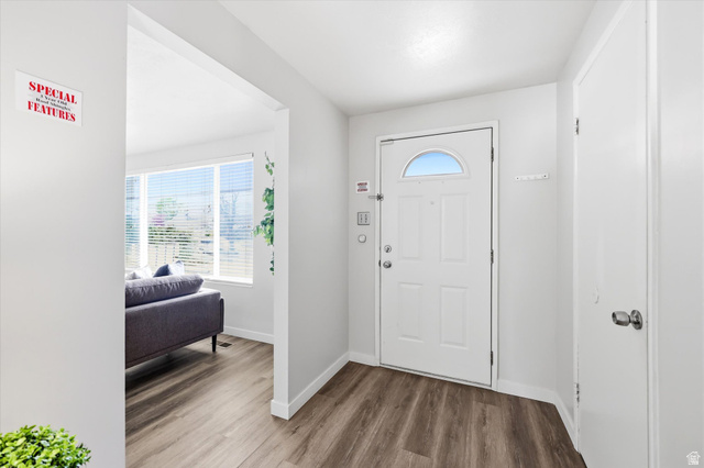 215 Carol Way Midvale, UT 84047 - Photo 2 of 30 Foyer entrance featuring plenty of natural light and wood finished floors